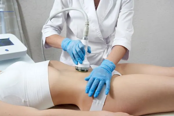 Lost the Weight but Not the Loose Skin? 2 woman having HIFU treatment on her stomach to combat loose skin Lincolnshire following weight loss